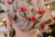 a creative and fun holiday updo with a large braid and red berries tucked in is a unique solution for the holidays