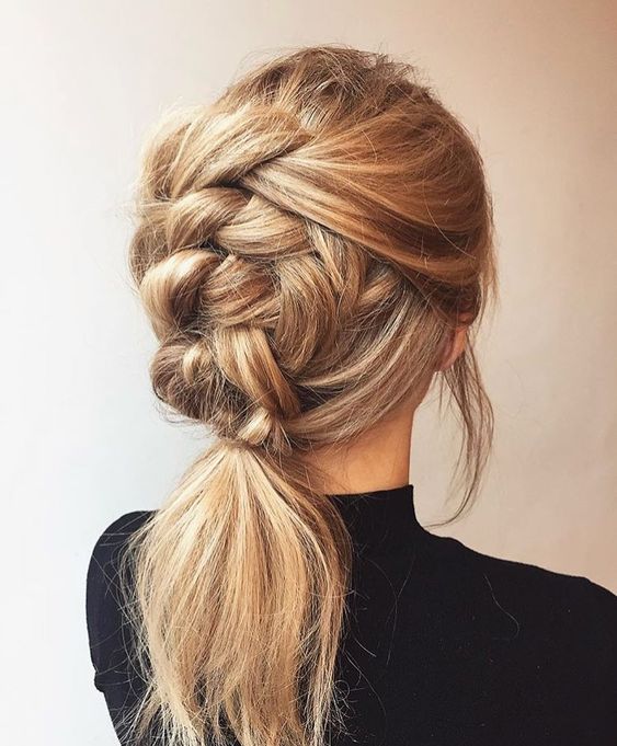 a creative chunky braid ending up in a ponytail and with a messy top is a cool idea for many kinds of parties