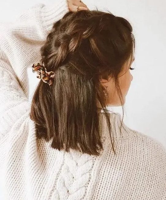 a creative dark brown half up wedding hairstyle with large braids on top and hair down is a cool idea for a lovely and cool party outfit