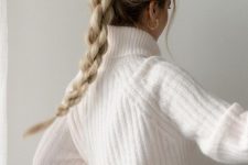 a creatively woven braid with a sleek top and face-framing hair is a cool idea for a holiday party