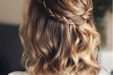 a light brown long bob with golde blonde balayage, waves and a braided halo is a chic and stylish idea for a wedding