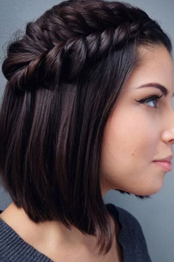 a long angled bob with a side fishtail braid that makes a stylish statement