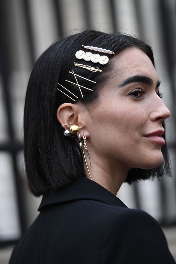 a long straight bob accented with multiple hair pins in various styles is a super bold and cool idea