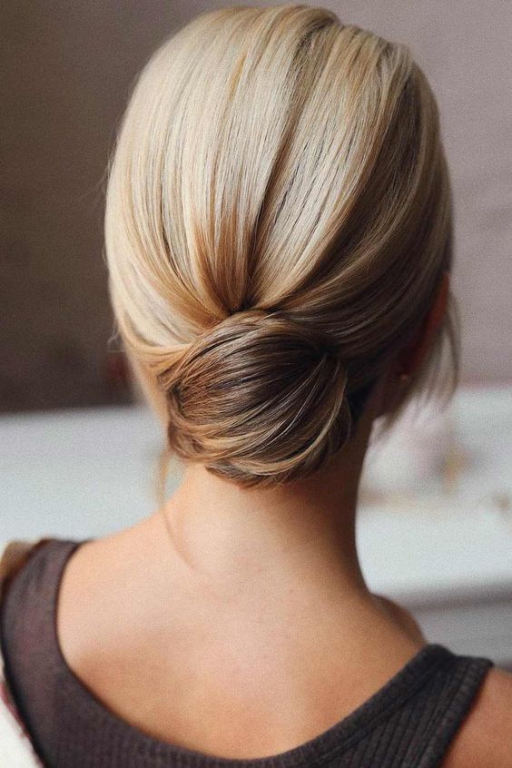 a lovely and classy sleek low bun with some voluem on top is a cool solution to rock, it looks nice