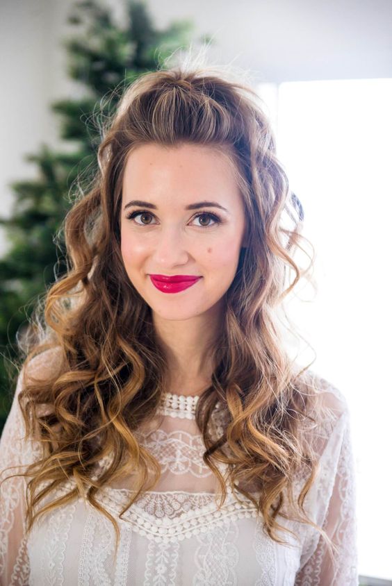 a pretty and cool half updo with a bump on top, a ponytail, some curls down is a cool idea for the holidays