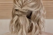 a simple and cool half updo with a bump on top, a twisted element and waves down is a cool idea to rock