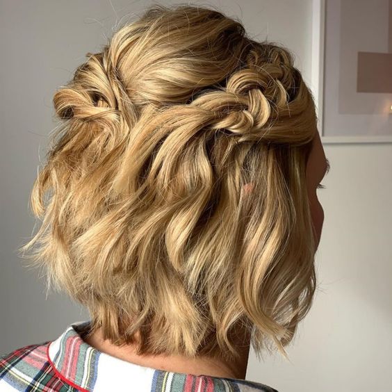 a volumetric blonde long bob with a bump on top, waves and side braids is a catchy and cool idea