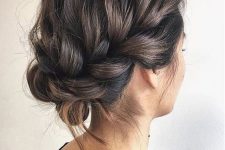 an updo with a loose braid on the side and a bump on top is a cool and catchy solution for a holiday party