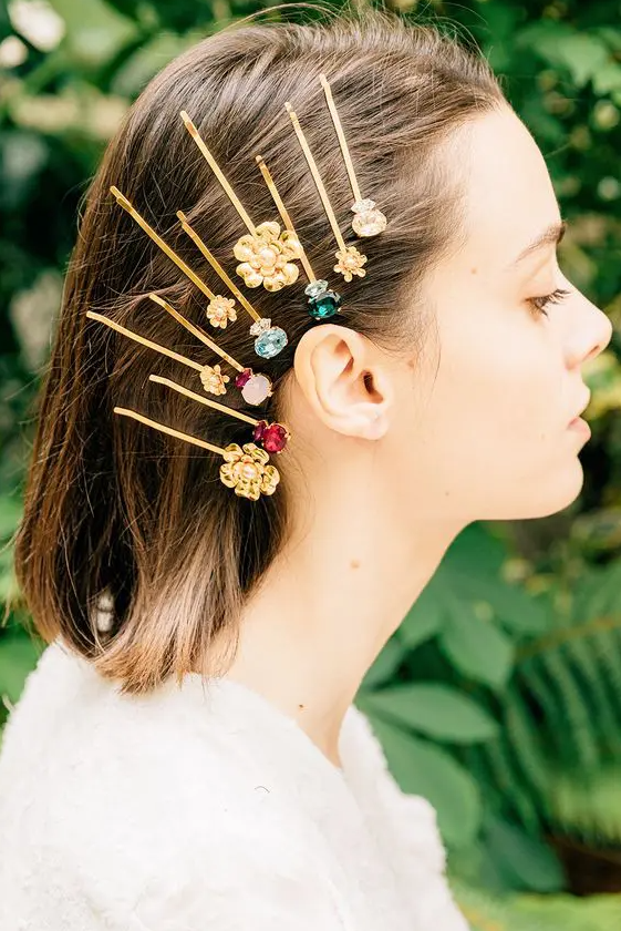 Multiple floral and gemstone hairpins will make even a simple hairstyle bold and eye catchy