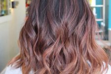 02 a black base with rose gold balayage with subtle waves looks very chic