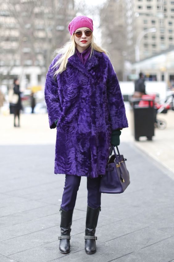 a bold ultraviolet fur coat, pants, boots and a pink beanie for a colorful winter look