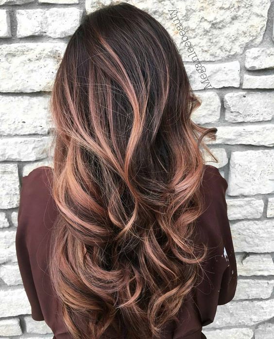 a black root with rose gold balayage looks softer and more refined