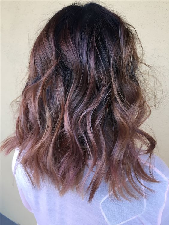 a dark root with rose gold balayage for an interesting look