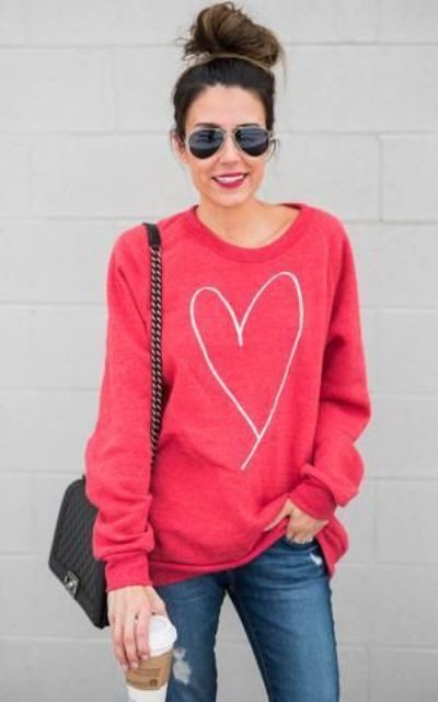 ripped jeans, a pink heart sweatshirt is all you need for a comfy look