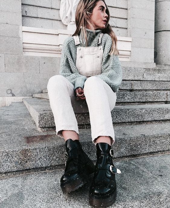 a grey turtleneck sweater, a white denim overal and grunge black boots