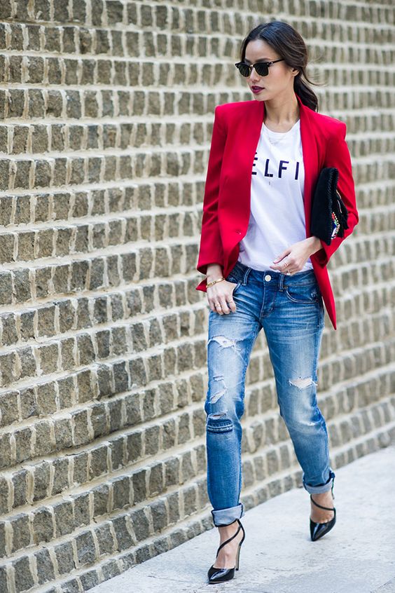 ripped jeans, a printed tee, a hot red blazer and black strappy shoes