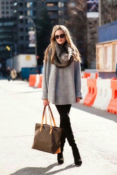 black suede boots, black skinnies, a grey oversized sweater, a faux fur scarf