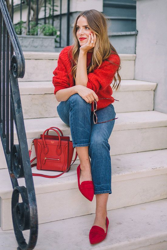 a red chunky knit sweater, cropped jeans, fuchsia flats and a red bag