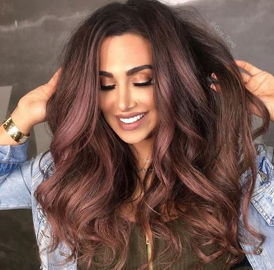 rose gold highlights on chocolate brown hair for a unique look