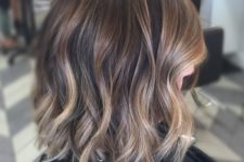 08 short brunette hair with gold balayage and light waves looks super chic