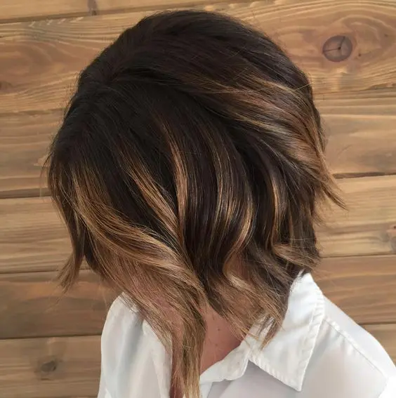 a caramel brunette balayage bob with dark smudge root looks super chic