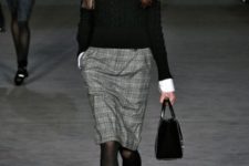 09 a white shirt, a black sweater over it, a tweed knee skirt, black tights and shoes