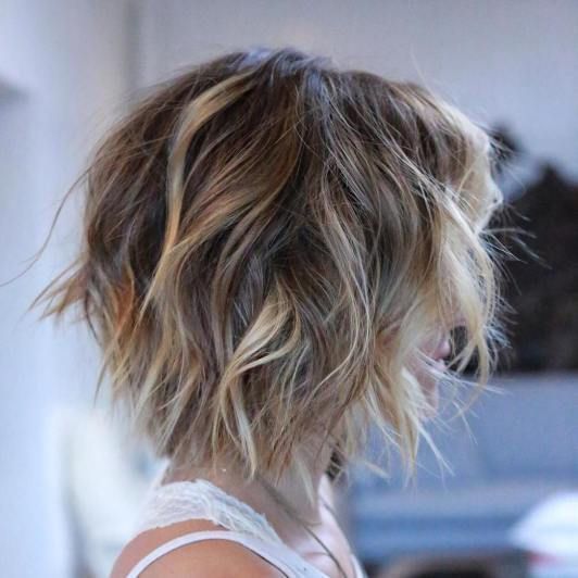 beachy waves on brown short hair plus subtle blonde balayage to get a sunkissed look