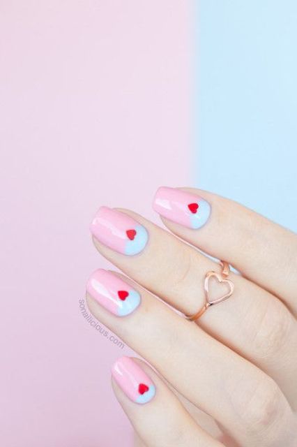 a lunar manicure in pastel pink and blue plus little red hearts