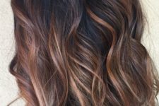 10 black hair with red and caramel balayage to add a warm touch and chic