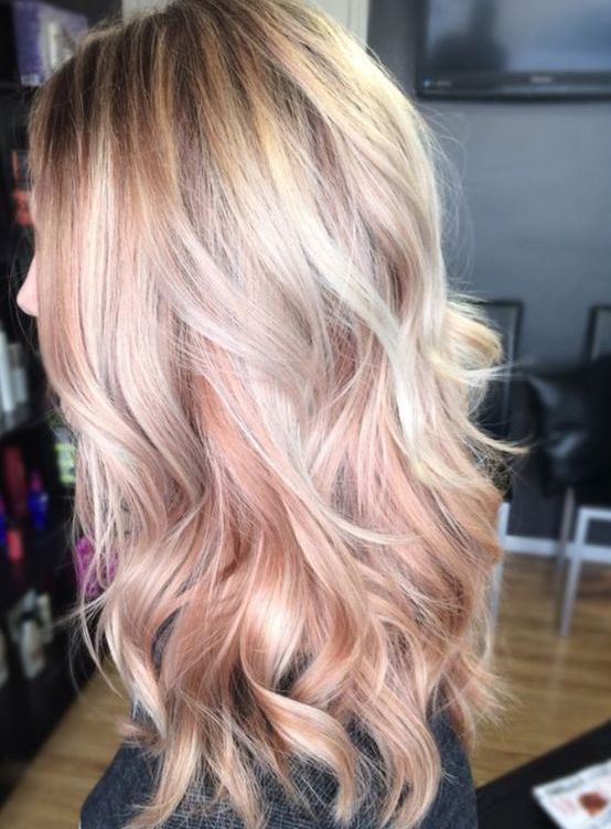 blonde hair with rose gold highlights looks very girlish