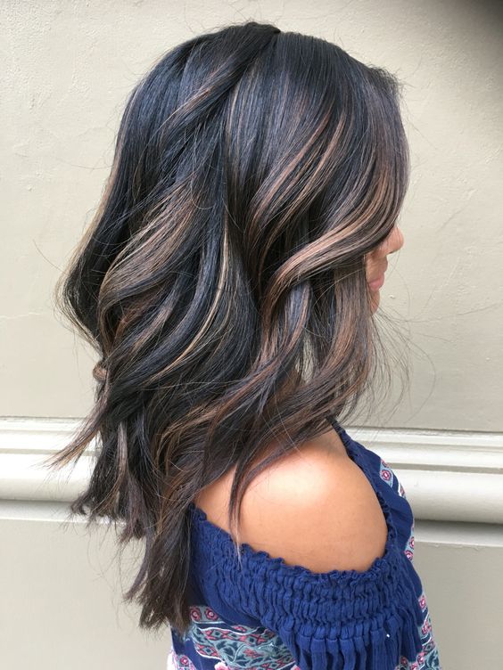 give your black hair dimension with brown and caramel balayage