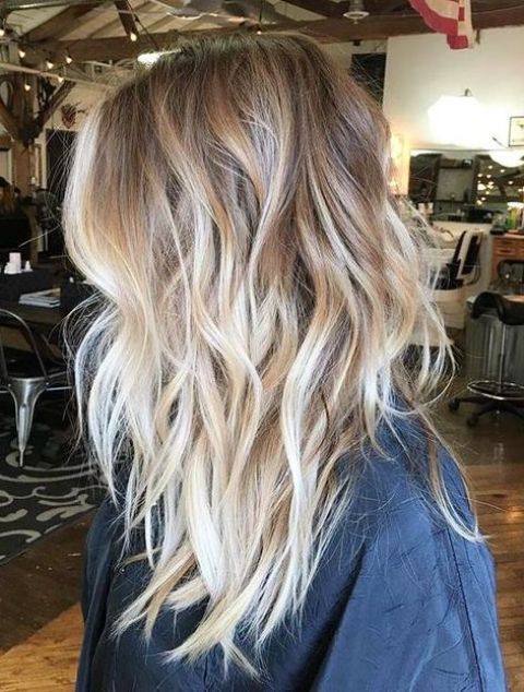 light wavy layered bronde hair with blonde balayage for a highlight