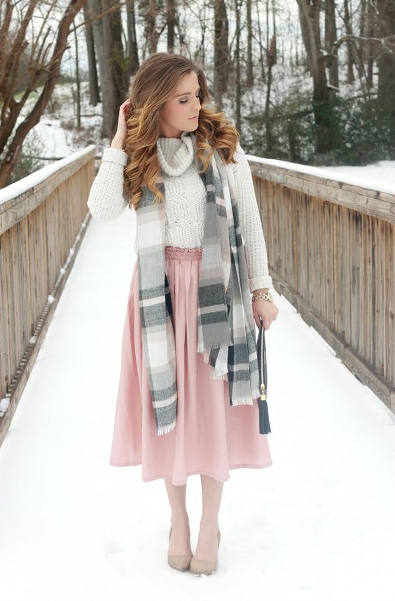 a neutral cable knit sweater, a pink skirt, nude heels and a striped scarf