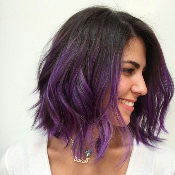 dark brown roots with purple ombre for a bold and cool look