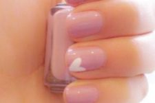 14 pink nails with one single white heart for a subtle touch