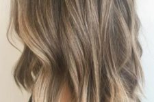 perfectly bronded balayage on wavy shoulder-length hair looks casual yet interesting