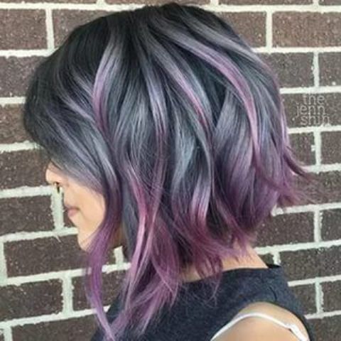 short ashy blue wavy bob with purple balayage looks super bold and attracts attention