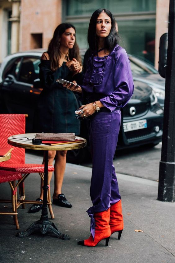 a silk ultraviolet jumpsuit and orange velvet boots for a super bold look