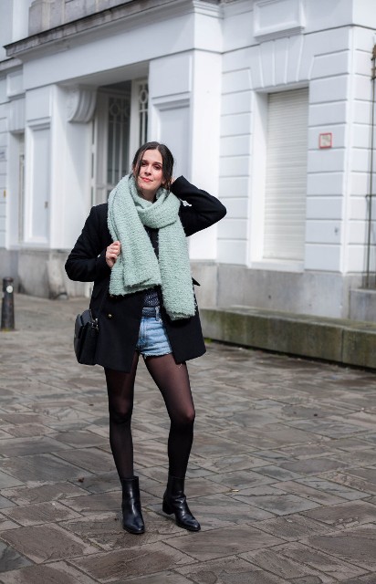 With black mini coat, ankle boots, mint green scarf and black bag