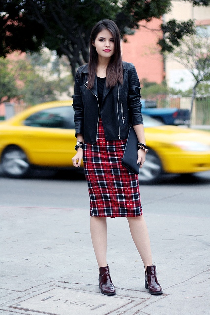 With black shirt, black leather jacket, marsala boots and clutch