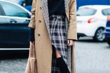 With black shirt, midi coat, fur bag and over the knee boots