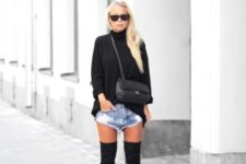 With black turtleneck sweater, chain strap bag and over the knee boots