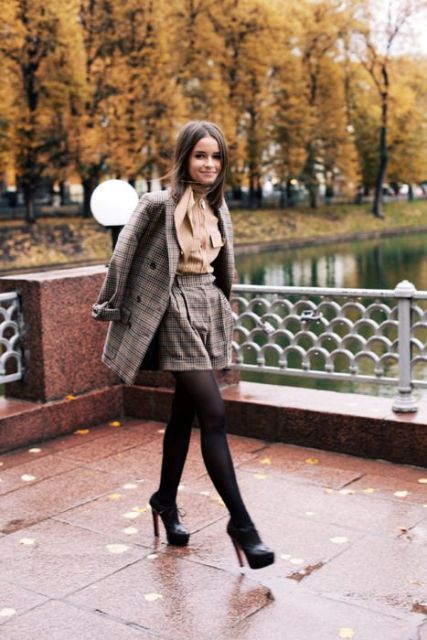With brown blouse, tweed blazer, black tights and ankle boots