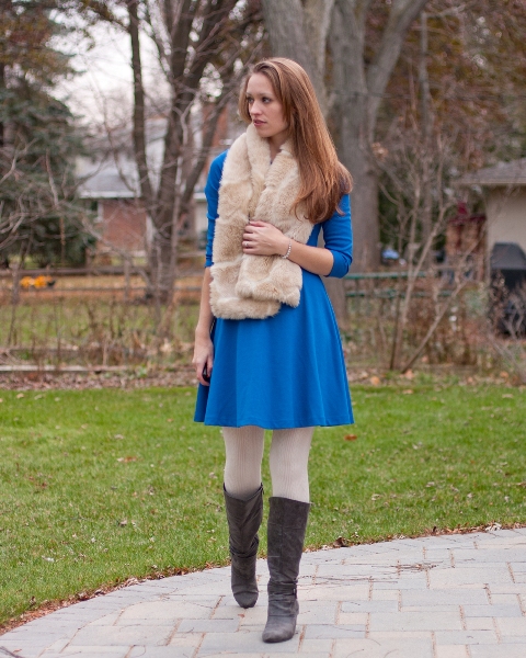 With cobalt blue dress, white tights and gray high boots