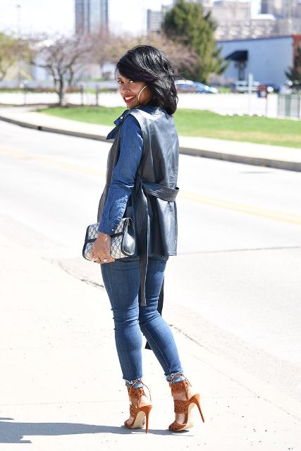 With denim shirt, jeans, brown heels and printed clutch