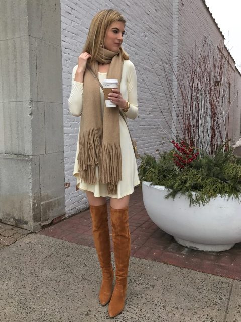 With dress, over the knee boots and crossbody bag