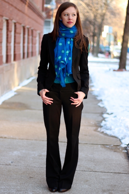With flare trousers, blazer and boots