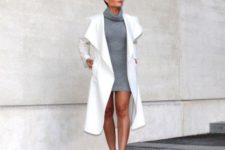 With gray sweater dress and white pumps