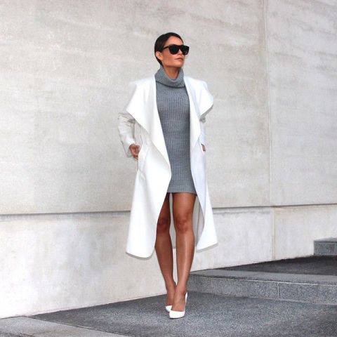 With gray sweater dress and white pumps