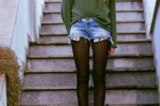 With green loose sweater and brown lace up boots